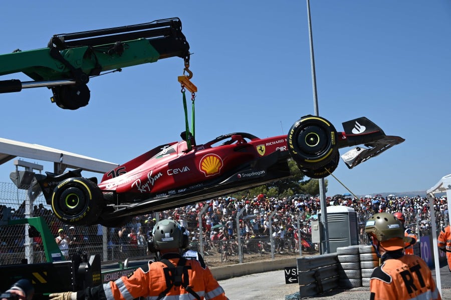 The car of Ferrari's Monegasque driver Charles Leclerc is evacuated after he crashed during the French Formula One Grand Prix at the Circuit Paul-Ricard in Le Castellet, southern France, on July 24, 2022. -- Pic: AFP