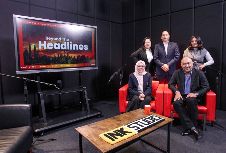 Centre to Combat Corruption and Cronyism chief executive officer Pushpan Murugiah (seated, right) and Associate Professor Datuk Dr Shamrahayu Ab Aziz (seated, left) with the hosts of the ‘Beyond the Headlines’ podcast in Balai Berita. -NSTP/AZIAH AZMEE