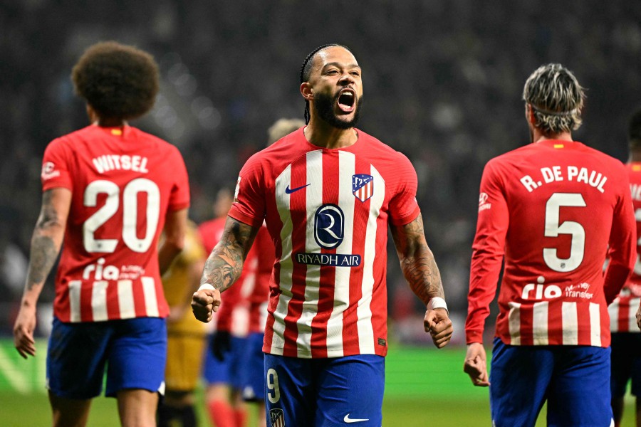 Atletico Madrid's Dutch forward #09 Memphis Depay celebrates scoring his team's second goal during the Spanish league football match between Club Atletico de Madrid and Rayo Vallecano de Madrid at the Metropolitano stadium in Madrid. -AFP/JAVIER SORIANO