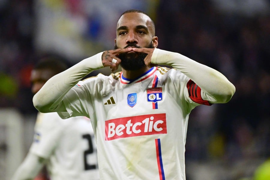 Lyon's French forward #10 Alexandre Lacazette celebrates after scoring during the French Cup (Coupe de France) semi final match between Olympique Lyonnais (OL) and Valenciennes FC at the Groupama Stadium, in Decines-Charpieu, east of Lyon on April 2, 2024. -AFP/Olivier CHASSIGNOLE