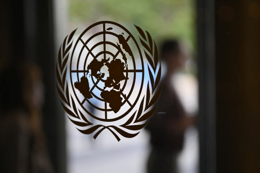 The UN logo is seen on a door at the United Nations headquarters. The Palestinians on Tuesday officially revived their bid for a full member state in the United Nations. -AFP/ANGELA WEISS