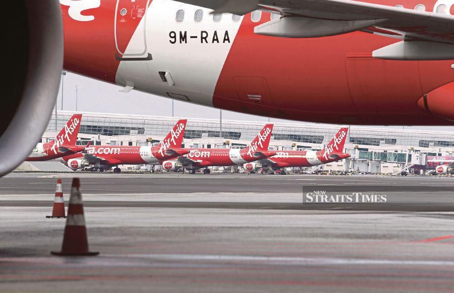 (FILE PHOTO) AirAsia planes. Transport Minister Anthony Loke has announced fixed fares for AirAsia flights to Sabah and Sarawak for the upcoming Chinese New Year, starting at RM298. -NSTP FILE