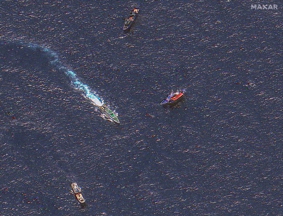 This handout satellite image released by Maxar Technologies on March 24, 2024 shows Chinese and Philippine ships in waters where the Philippines said the China Coast Guard blocked their supply vessel and damaged it with water cannon. -AFP/Satellite image/ Maxar Technologies