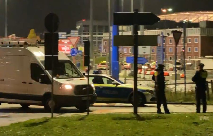 Traffic at Hamburg airport was halted and the terminals evacuated over a "hostage situation" believed to have arisen over a custody dispute. Screengrab shows emergency services at the scene. -PIC CREDIT: X