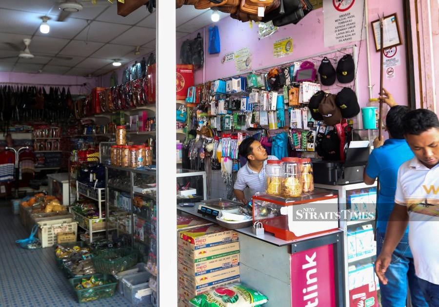 MPKB conducts checks on business premises following a massive immigration crackdown in Kota Baru. -NSTP/NIK ABDULLAH NIK OMAR