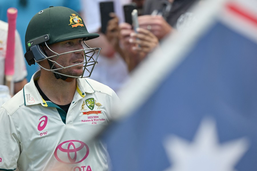 Australia's David Warner walks out to bat during his 112th and final Test on day four of the third cricket Test match between Australia and Pakistan at the Sydney Cricket Ground in Sydney on January 6, 2024. -AFP/Saeed KHAN