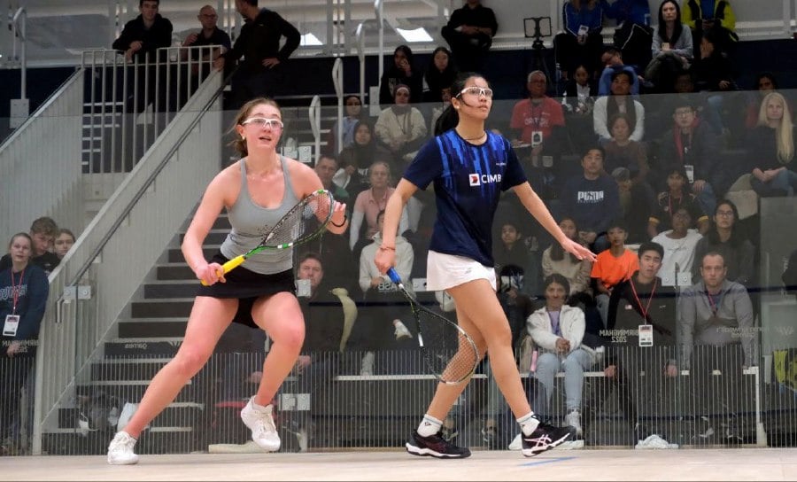 Malaysia's Harleein Tan (right) in action against Savannah Moxham of Belgium in the girls' Under-15 quarter-finals at the British Junior Open in Birmingham on Friday. -PIC COURTESY OF BJO
