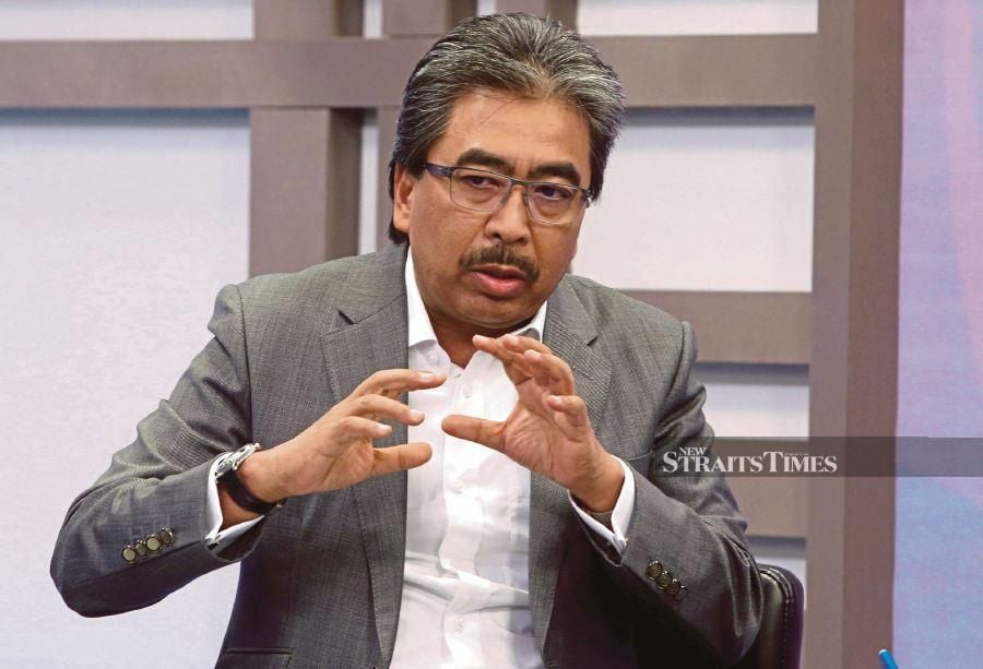 (FILE PHOTO) Plantations and Commodities Minister Datuk Seri Johari Abdul Ghani has doubled down on the proposal for the government to get tough with errant firms that deceive foreign workers with jobs and leave them in the lurch once they arrive in Malaysia. -NSTP FILE/HAIRUL ANUAR RAHIM