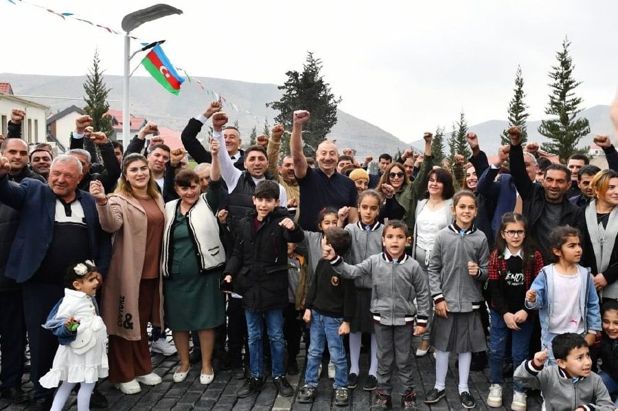 Ilham Aliyev (centre) celebrate 'victory' with Azeris.