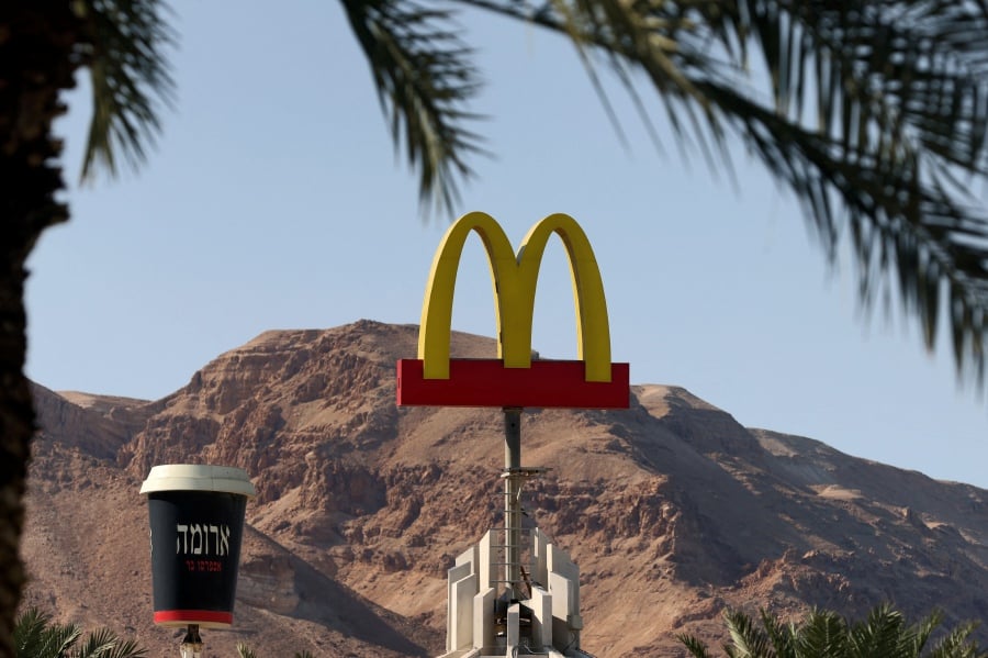 (FILE PHOTO) McDonald's restaurant's iconic "golden arches" logo. McDonald's reported higher quarterly profits Monday, although comparable sales growth slowed as it cited a blow from war in the Middle East. -AFP/Emmanuel DUNAND