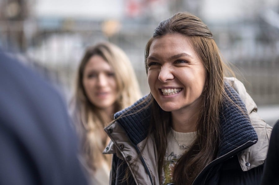 (FILE PHOTO) Former world number one tennis player Romania's Simona Halep arrives at the Court of Arbitration for Sport in Lausanne. The Court of Arbitration for Sport (CAS) on March 5, 2024 reduced the four-year doping ban imposed on Romania's former world number one Simona Halep to nine months, which have already been served. -AFP/Fabrice COFFRINI