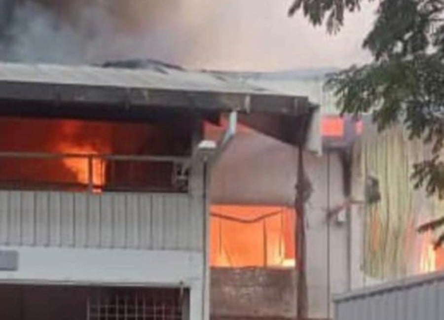 A Proton service centre located in a warehouse in Segambut caught fire. -PIC COURTESY OF FIRE AND RESCUE DEPARTMENT