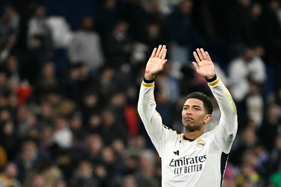 Real Madrid's English midfielder #5 Jude Bellingham waves during the UEFA Champions League last 16 second leg football match between Real Madrid CF and RB Leipzig on March 6, 2024. - AFP pic