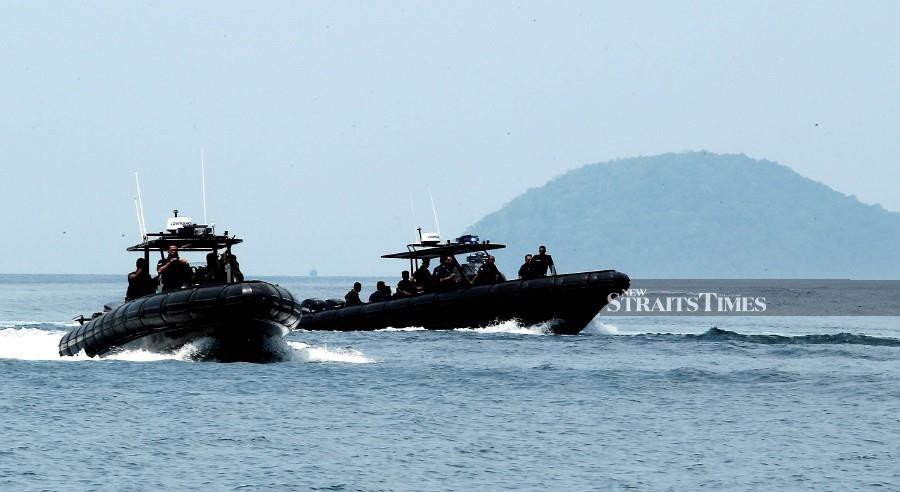 (FILE PHOTO) The security level in Kunak waters have been increased following a gunfight which left two Malaysian Maritime Enforcement Agency (MMEA) injured. -NSTP FILE