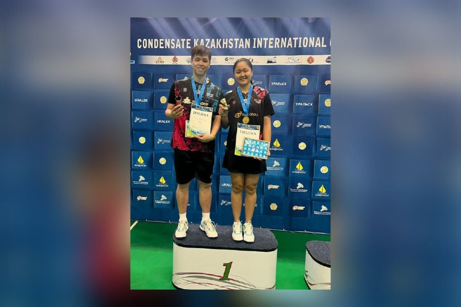 Wong Tien Chi (left) and Lim Chiew Sien with their medals after winning the mixed doubles title at the Kazakhstan International Challenge in Uralks on Saturday. -COURTESY PIC