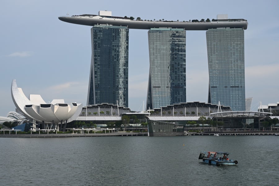 Singapore’s central bank on Monday kept its monetary policy settings unchanged(Photo by Roslan RAHMAN / AFP)