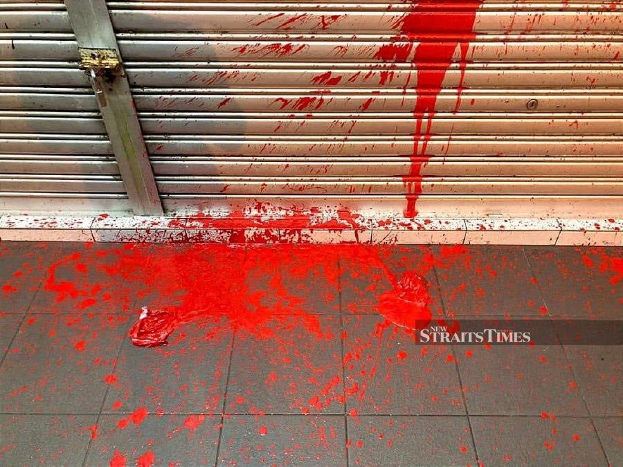 A man suspected of splashing red paint onto four pork-selling shops. -NSTP/MELVIN JONI