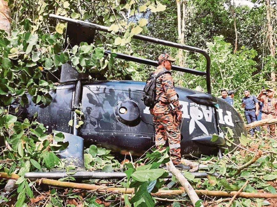 (FILE PHOTO) On September 11, last year, an Airbus Helicopters Eurocopter EC120B crashed in the Chikus Forest Reserve in Kampung Kenangan, Bidor, Perak. -PIC COURTESY OF FIRE AND RESCUE DEPARTMENT