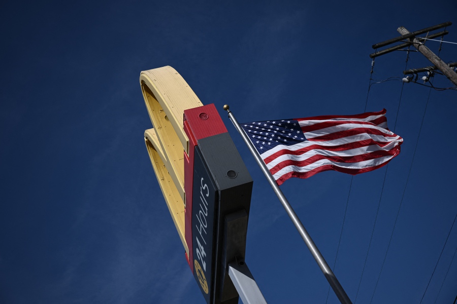 The McDonald's logo is seen outside a restaurant in Washington. McDonald’s announced an aggressive expansion roadmap on Wednesday to reach 50,000 restaurants worldwide by 2027, as the chain unveiled plans to roll out CosMc’s, a new network of small-format shops focused on cold beverages. -AFP/Brendan SMIALOWSKI