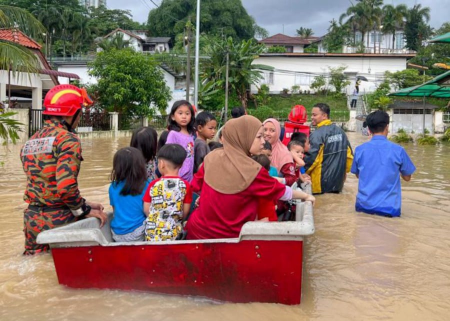 Flash floods in several areas in Johor’s capital city was due to exceptionally heavy rainfall and high tides. -PIC COURTESY OF FIRE AND RESCUE DEPARTMENT