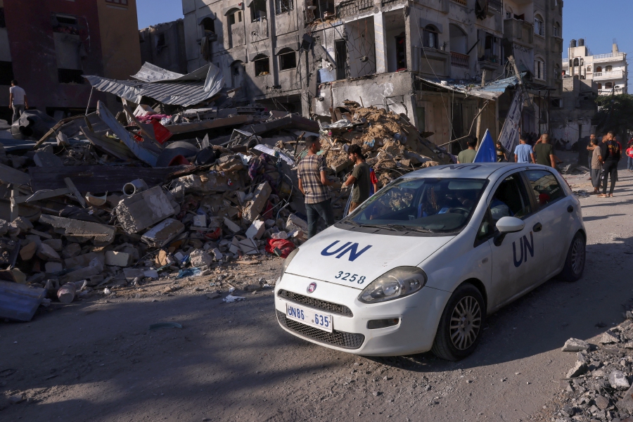 (FILE PHOTO) A car bearing the United Nations (UN) logo drives past rubble in the aftermath of Israeli bombing in Rafah in the southern Gaza Strip. -AFP/SAID KHATIB
