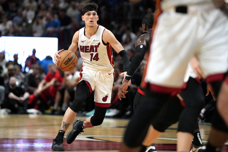 Miami Heat guard Tyler Herro (14) brings the ball up the court against the Houston Rockets during the second half at Kaseya Center. -REUTERS/Jim Rassoll/SA TODAY Sports