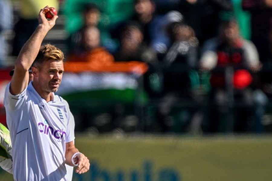 England's James Anderson gestures after taking the wicket of India's Kuldeep Yadav during the third day of the fifth and last Test cricket match between India and England at the Himachal Pradesh Cricket Association Stadium in Dharamsala. England's James Anderson on March 9 took his 700th Test wicket, becoming just the third bowler in world cricket to achieve the landmark. -AFP/Sajjad HUSSAIN