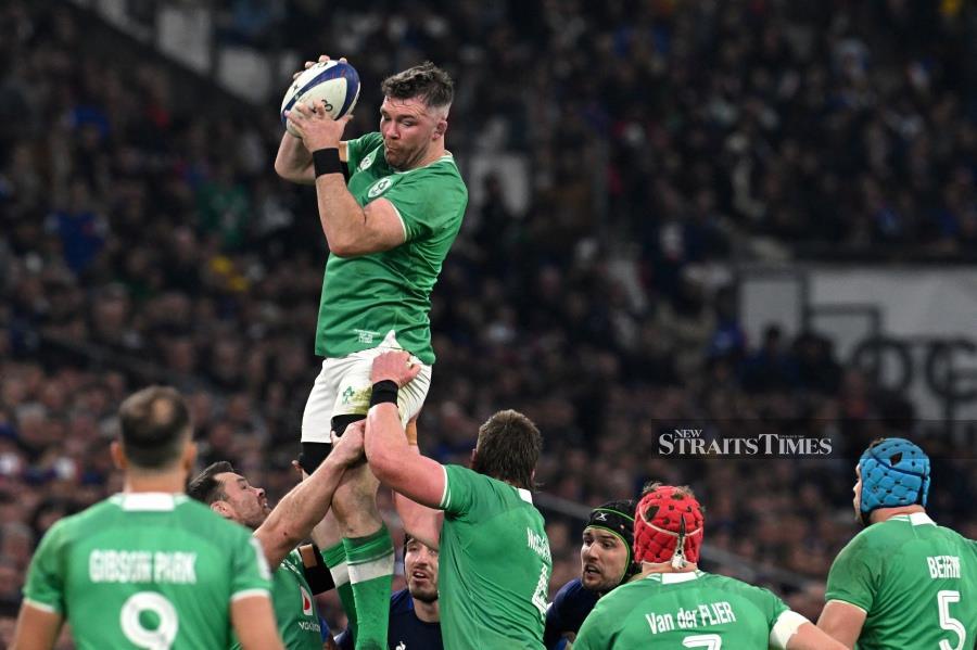 Ireland's flanker and captain Peter O'Mahony (centre) catches the ball as he is lifted into the air for an Ireland lineout during the Six Nations international rugby union match in Marseille, south-eastern France. -AFP/NICOLAS TUCAT