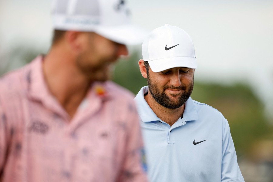Scottie Scheffler of the United States laughs as he and Sam Burns of the United States walk the 17th hole during the second round of the Arnold Palmer Invitational presented by Mastercard at Arnold Palmer Bay Hill Golf Course in Orlando, Florida. -AFP/Cliff Hawkins