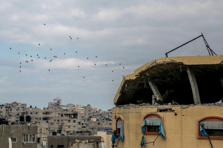Aid parcels are airdropped over the northern Gaza Strip on March 8, 2024. The US military said it carried out a fresh aid airdrop of aid into Gaza. The UN's World Food Programme warned the volume of aid that could be airdropped would do nothing to avert famine in Gaza.-AFP PIC
