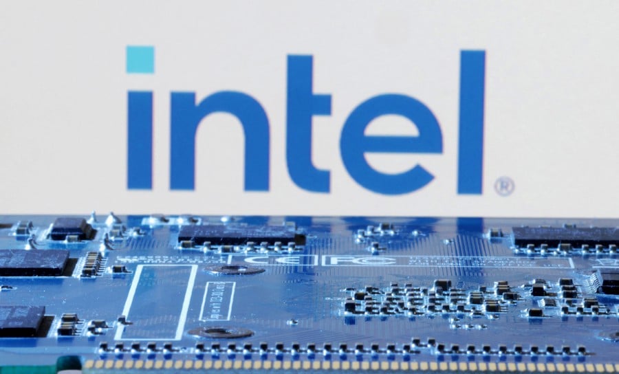 Intel logo is seen near computer motherboard. Chinese automaker Zeekr will be the first automaker to use Intel’s AI system on a chip to create “an enhanced living room experience” in vehicles, including AI voice assistants and video conferencing, Intel’s automotive business chief Jack Weast said ahead of the CES technology show in Las Vegas. -REUTERS/Dado Ruvic
