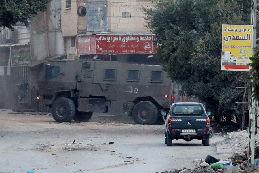An Israeli army vehicle operates during an Israeli raid in Jenin, in the Israeli-occupied West Bank, November 9, 2023. -REUTERS/Raneen Sawafta