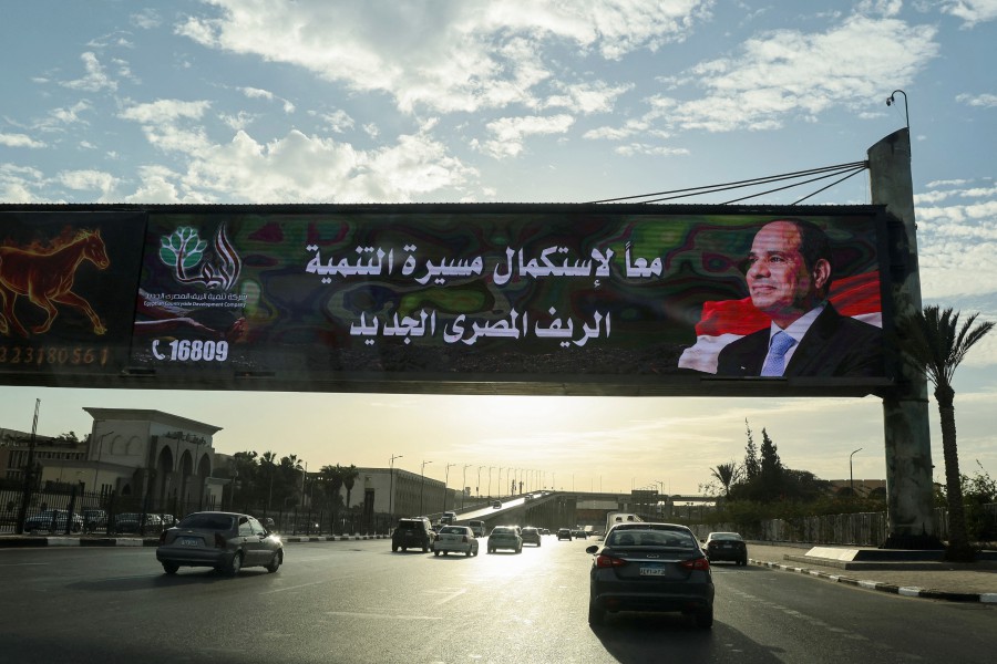 Vehicles drive past a billboard for presidential candidate and current Egyptian President Abdel Fattah al-Sisi, ahead the upcoming presidential elections, in Cairo, Egypt. -REUTERS/Amr Abdallah Dalsh