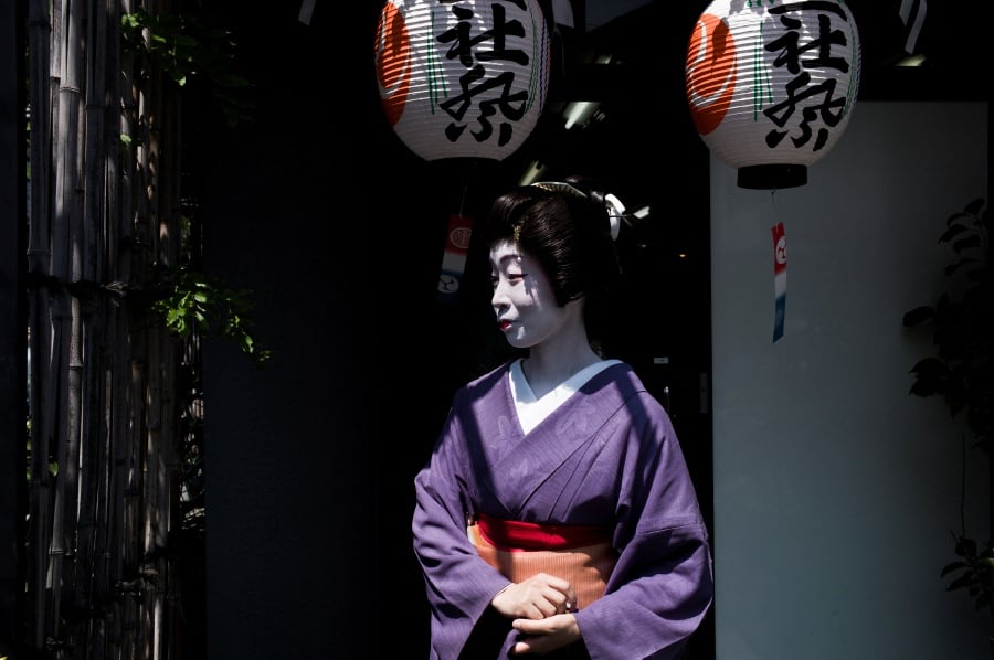 (FILE PHOTO) A geisha waits prior to the Sanja Matsuri festival in Tokyo. -AFP/FRED DUFOUR
