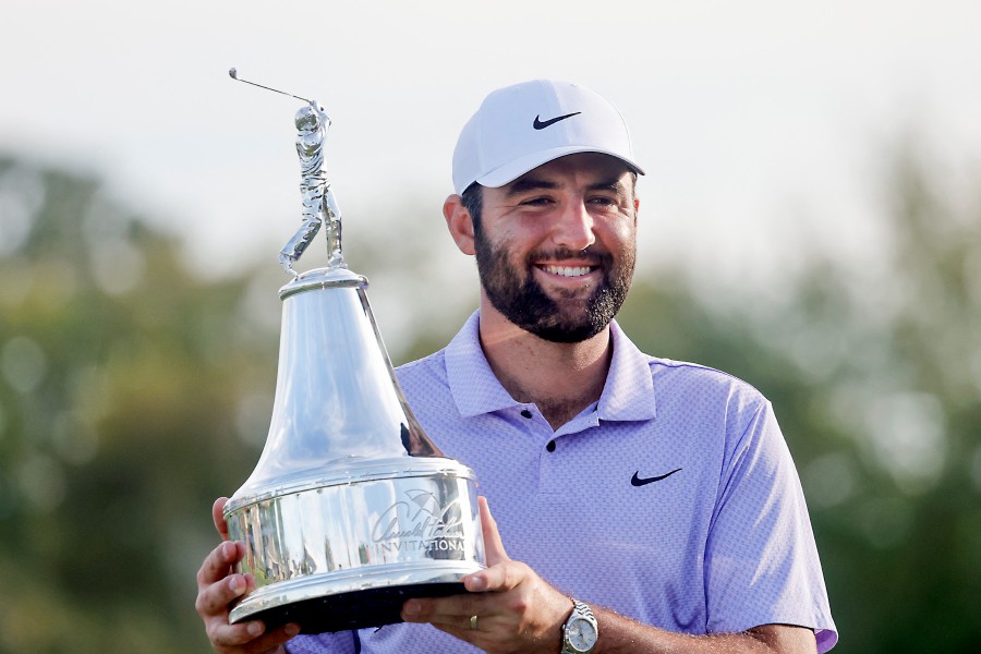 Scottie Scheffler holds the champions trophy after winning the Arnold Palmer Invitational golf tournament. -REUTERS/Reinhold Matay-USA TODAY Sports