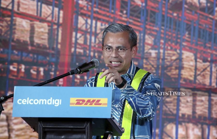 Communications and Digital Minister Fahmi Fadzil at the launch of Malaysia’s First 5G Autonomous Warehouse event at DHL Supply Chain. -NSTP/HAIRUL ANUAR RAHIM