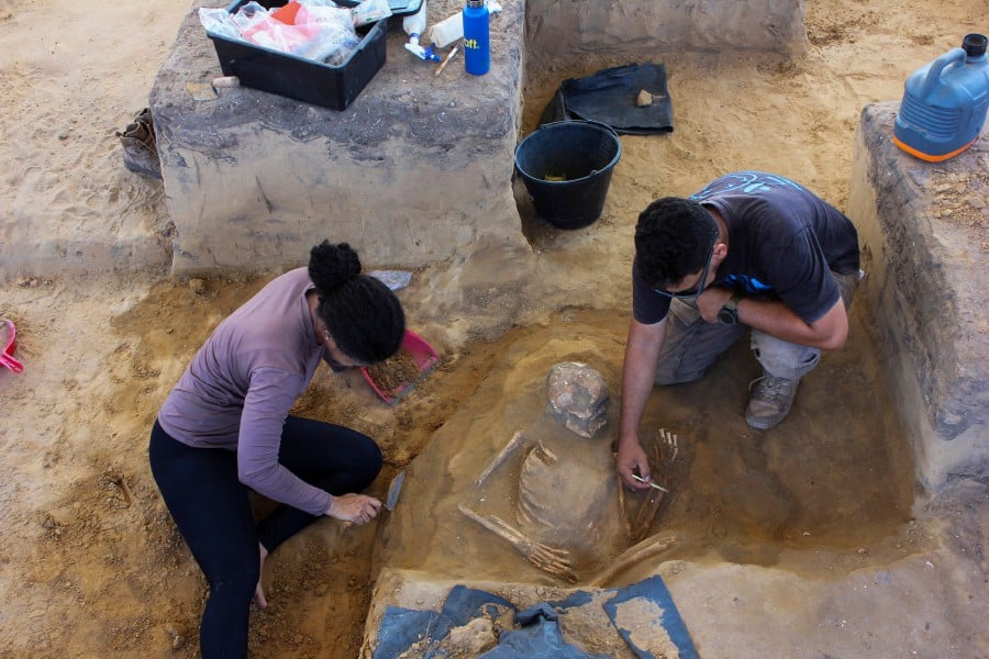 This handout picture released by WLage Arqueologia shows archaeologists carrying out an excavation at an archaeological site discovered inside the construction area of a complex of popular apartments in the city of Sao Luis, Maranhao state, Brazil on January 9, 2024. Workers were just starting construction on a new condominium in northeastern Brazil when they began finding human bones and pottery shards, their edges worn smooth by time. They turned out to be vestiges of ancient peoples who left thousands of artifacts at the site in the coastal city of Sao Luis as far back as 9,000 years ago -- a treasure trove archaeologists say could rewrite the history of human settlement in Brazil. -AFP/Handout /WLage Arqueologia
