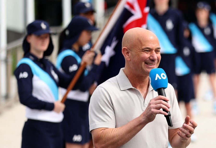 Former tennis player Andre Agassi speaks at the Australian Open 2024 trophy arrival ceremony on day one of the Australian Open tennis tournament in Melbourne. -AFP/Martin KEEP