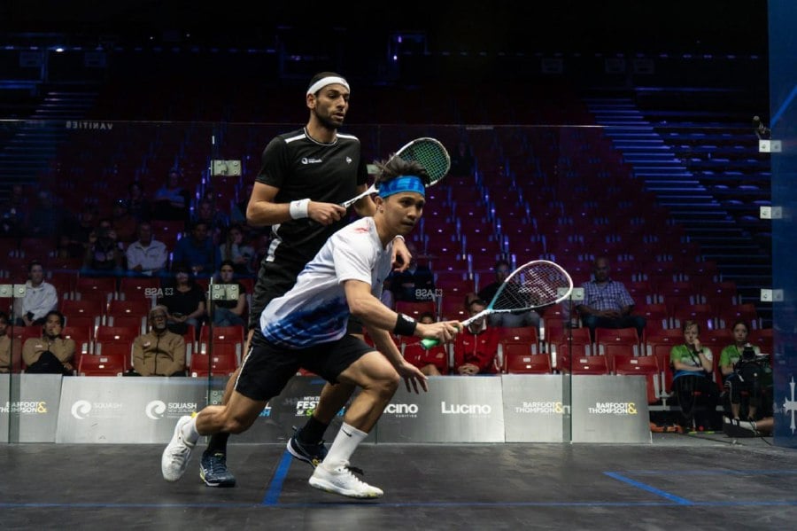 Malaysia’s Addeen Idrakie (in white) in action against England's Mohamed El Shorbagy in the World Team Championship in Tauranga, New Zealand.