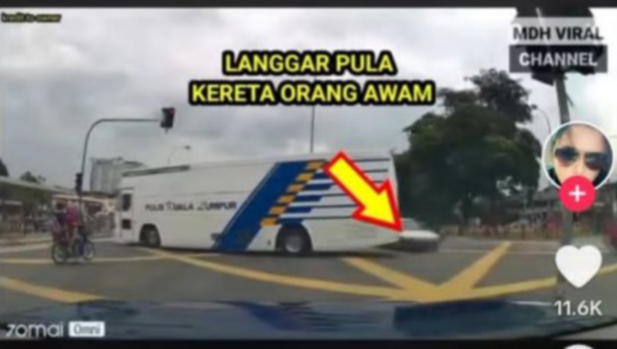 Screenshot of a video of a Proton Wira involved in a collision with a police bus in Taman Greenwood, Gombak on Wednesday. -PIC CREDIT: HARIAN METRO