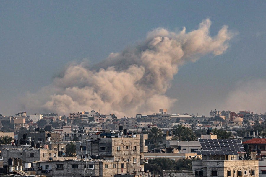 This photograph taken on January 15, 2024 from Rafah shows smoke billowing over Khan Yunis in the southern Gaza Strip during Israeli bombardment. -AFP PIC