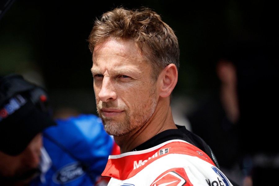 (FILE PHOTO) Britain's Jenson Button, driver of the #15 Mobil 1 Ford, looks on in the garage area during practice for the NASCAR Cup Series Grant Park 220 at the Chicago Street Course in Chicago, Illinois. It is 15 years since Jenson Button claimed the Formula One drivers championship but as the World Endurance Championship (WEC) prepares to get underway at the end of February, the Briton told AFP he is eyeing new peaks, not least the iconic Le Mans 24 Hours race. Button, who turns 44 on January 19, 2024, has remained busy in motor sport since stepping away from the F1 grid at the end of the 2016 season but he is now making a full-time return to racing at the wheel of a Porsche 963 with Hertz Team JOTA. -AFP/Sean Gardner