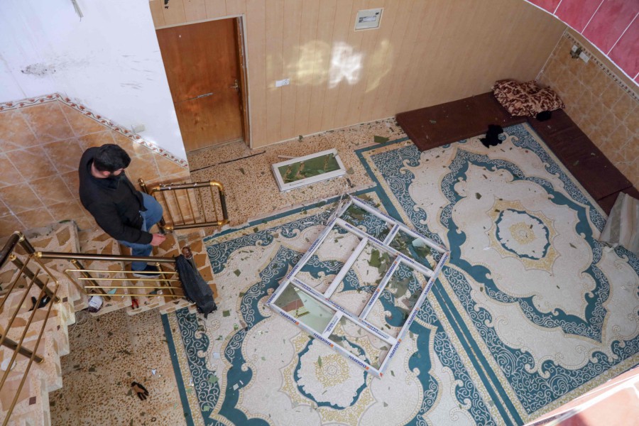 A man inspects the damage at a home following a missile strike launched by Iran's Revolutionary Guard Corps (IRGC) on the Kurdistan Region’s capital of Arbil. The IRGC have launched missile attacks on multiple "terrorist" targets in Syria and in Iraq's autonomous Kurdistan region. -AFP/Safin HAMID