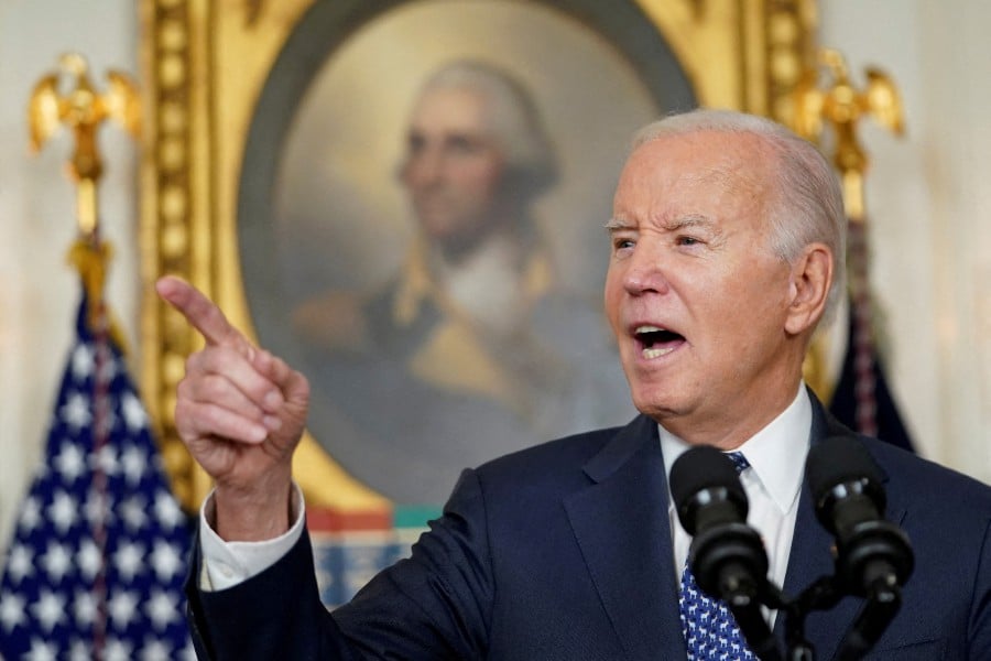 (FILE PHOTO) US President Joe Biden gestures as he delivers remarks at the White House in Washington. -REUTERS/Kevin Lamarque