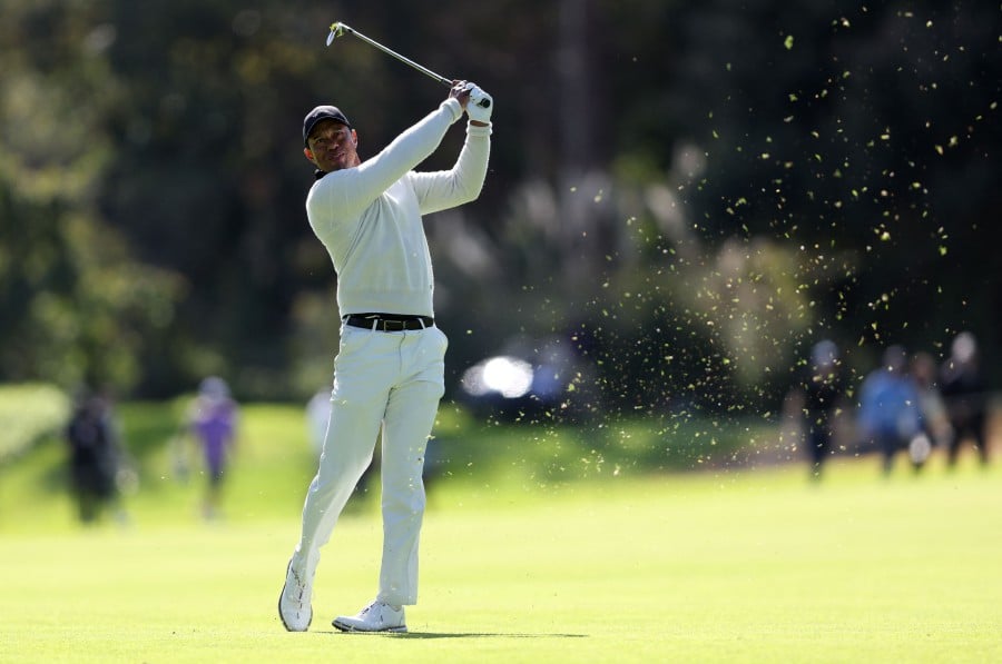 Tiger Woods of the United States plays a shot on the 18th hole during the first round of The Genesis Invitational at Riviera Country Club in Pacific Palisades, California. -AFP/Michael Owens