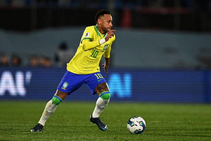 (FILE PHOTO) Brazil's forward Neymar controls the ball. Coach Fernando Diniz said, no player in Brazil should feel pressure to take over the role of Neymar, sidelined with a ruptured anterior cruciate ligament and meniscus ahead of the World Cup qualifiers against Colombia and Argentina. -AFP/Eitan ABRAMOVICH