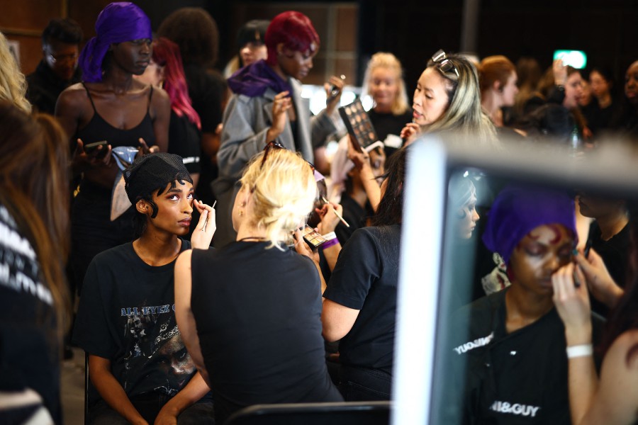 Models are prepared back-stage ahead of a catwalk presentation by British-Nigerian designer Tolu Coker for her Autumn/Winter 2024 collection during London Fashion Week in London. -AFP/HENRY NICHOLLS