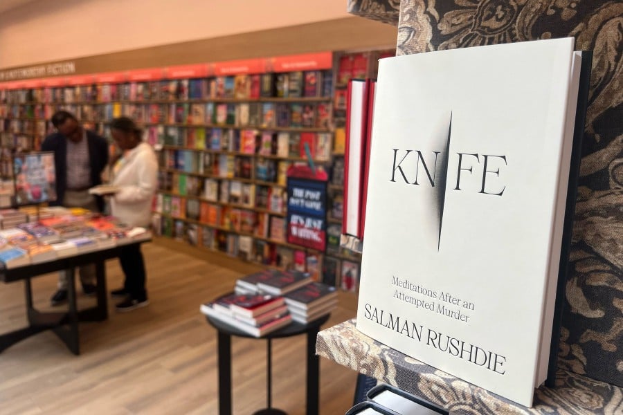 British-US author Salman Rushdie's new book "Knife" is pictured in a bookstore in Los Angeles, California on April 15, 2024. British-American author Salman Rushdie releases his memoir "Knife" recounting the harrowing experience of being stabbed at a public event in 2022 and how he overcame the near-fatal ordeal. -AFP/Gilles CLARENNE