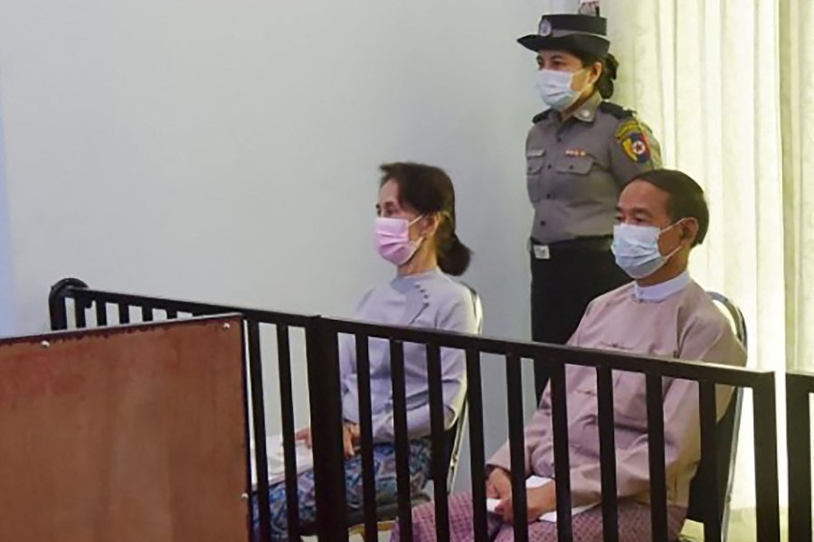(FILE PHOTO) This handout photo taken on May 24, 2021 and released by Myanmar's Ministry of Information on May 26 shows detained civilian leader Aung San Suu Kyi (left) and detained president Win Myint (right) during their first court appearance in Naypyidaw, since the military detained them in a coup on February 1. Myanmar's junta has moved jailed democracy icon Aung San Suu Kyi from prison to house arrest, a source told AFP on April 17, 2024. -AFP/Handout /MYANMAR MINISTRY OF INFORMATION