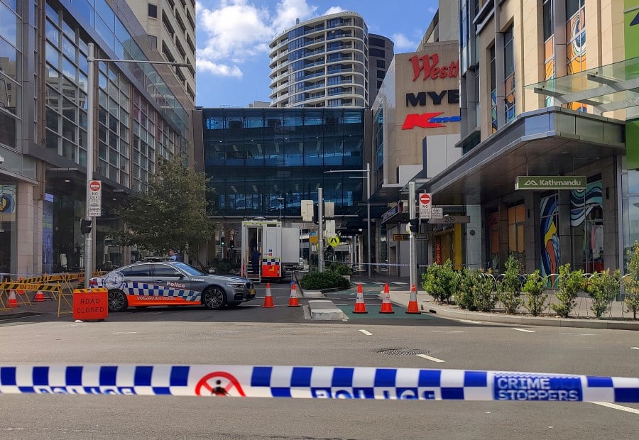 A view of a police car outside Westfield Bondi Junction as the mall remains under lockdown following Saturday’s stabbings in Sydney, Australia April 14, 2024. REUTERS/Alasdair Pal